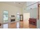 Bright living room with high ceilings, fireplace, hardwood floors, and ample natural light at 12955 Mariners Ct, Alpharetta, GA 30005