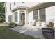 Concrete patio with outdoor seating and view of the backyard, accessible through glass doors at 12955 Mariners Ct, Alpharetta, GA 30005