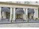 Entrance featuring black awnings, stately columns, and elegant landscaping at 199 14Th St # 2502, Atlanta, GA 30309