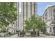 Luxury building entrance with manicured landscaping and signage at 199 14Th St # 2502, Atlanta, GA 30309