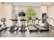 Fitness center featuring elliptical machines, treadmills, and large windows at 199 14Th St # 2502, Atlanta, GA 30309