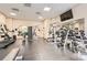 A fitness center features machines, weights, and a mounted TV screen at 199 14Th St # 2502, Atlanta, GA 30309