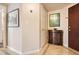 Hallway view with decorative floors, a small cabinet, and neutral paint at 199 14Th St # 2502, Atlanta, GA 30309