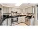 Modern kitchen with stainless steel appliances and neutral countertops at 199 14Th St # 2502, Atlanta, GA 30309