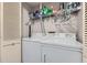 Laundry room featuring front loading washer and dryer with overhead shelving at 199 14Th St # 2502, Atlanta, GA 30309