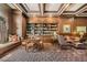 Cozy library with coffered ceilings, custom bookshelves, and comfortable seating at 199 14Th St # 2502, Atlanta, GA 30309