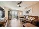 Comfortable living room with wood floors, leather seating, and a sliding glass door at 199 14Th St # 2502, Atlanta, GA 30309