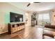 Cozy living room with hardwood floors, entertainment center, and balcony access at 199 14Th St # 2502, Atlanta, GA 30309