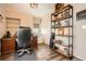 This well-lit office space features a desk, chair, and modern shelving unit for an efficient work environment at 199 14Th St # 2502, Atlanta, GA 30309