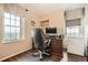 Office space with natural light, desk, chair, and hardwood floors at 199 14Th St # 2502, Atlanta, GA 30309