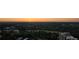 Scenic sunset aerial view overlooking a lush tree canopy and neighborhood homes at 199 14Th St # 2502, Atlanta, GA 30309