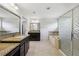 Spacious bathroom features a tub, a glass-enclosed shower, and dual vanities with granite countertops at 4630 Carriage Walk Ln, Cumming, GA 30040