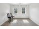 Cozy room featuring dual windows that provide ample natural light, and modern bar stools at 4630 Carriage Walk Ln, Cumming, GA 30040