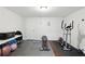 Home gym with weights, exercise equipment, and rubber flooring at 4630 Carriage Walk Ln, Cumming, GA 30040