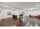 Large, versatile living area featuring hardwood floors and ample lighting at 4630 Carriage Walk Ln, Cumming, GA 30040