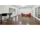 Spacious living area with hardwood floors, bar seating, and bright natural light at 4630 Carriage Walk Ln, Cumming, GA 30040