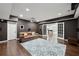 Basement entertainment area with projector, recessed lighting, and dark painted walls at 4630 Carriage Walk Ln, Cumming, GA 30040