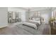 Expansive main bedroom showcases neutral décor, a tray ceiling and large windows at 4630 Carriage Walk Ln, Cumming, GA 30040