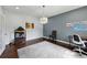 Bright office features hardwood floors, neutral walls, and chandelier lighting at 4630 Carriage Walk Ln, Cumming, GA 30040
