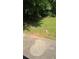 Patio area overlooking a lush backyard with a charming gazebo nestled among the trees at 65 King James Se Ct, Conyers, GA 30013