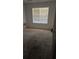 Bedroom with window and carpet at 65 King James Se Ct, Conyers, GA 30013