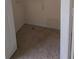 Empty closet with neutral carpet and a wire rack shelf offering storage space at 65 King James Se Ct, Conyers, GA 30013