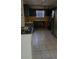 Kitchen with tile floor, dark cabinets, stainless steel appliances at 65 King James Se Ct, Conyers, GA 30013
