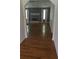Open living room with hardwood floors, a fireplace, and natural light from the window at 65 King James Se Ct, Conyers, GA 30013