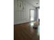 Spacious living room with hardwood floors and high ceilings, ready for your personal touch at 65 King James Se Ct, Conyers, GA 30013