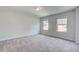 Spacious bedroom featuring neutral walls and dual windows at 100 Bree Dr, Fayetteville, GA 30214