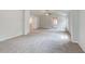 Open bonus room featuring neutral walls, plush carpet, and a ceiling fan at 100 Bree Dr, Fayetteville, GA 30214