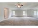 Large bonus room showcasing a tray ceiling and neutral walls at 100 Bree Dr, Fayetteville, GA 30214