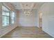 Elegant dining room featuring decorative trim, coffered ceilings, wood floors, and natural light at 100 Bree Dr, Fayetteville, GA 30214