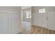 Foyer featuring decorative trim, wood floors, and a white entry door at 100 Bree Dr, Fayetteville, GA 30214