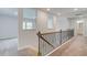 Upper hallway featuring decorative wrought iron railing and open views at 100 Bree Dr, Fayetteville, GA 30214