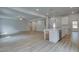 Spacious living room seamlessly flows to the modern kitchen area, perfect for entertaining and Gathering gatherings at 100 Bree Dr, Fayetteville, GA 30214