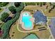 Aerial view of community pool and playground, highlighting recreational amenities at 1345 Aster Ives Dr, Lawrenceville, GA 30045