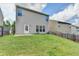 View of the home's backyard with a door and windows offering ample natural light at 1345 Aster Ives Dr, Lawrenceville, GA 30045