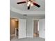 Large bedroom with neutral carpet, ceiling fan, and ample natural light from the window at 1345 Aster Ives Dr, Lawrenceville, GA 30045
