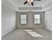 Bright bedroom with a ceiling fan, two windows, and plush carpeting, offering comfort and natural light at 1345 Aster Ives Dr, Lawrenceville, GA 30045