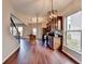Open-concept kitchen featuring stainless steel appliances and dark wood cabinets at 1345 Aster Ives Dr, Lawrenceville, GA 30045