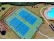 Aerial view showcasing the community's well-maintained tennis courts, perfect for recreational activities at 1345 Aster Ives Dr, Lawrenceville, GA 30045