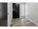 Inviting foyer with new flooring, dark entry door, and natural light from the side window at 213 Yuba Walk, Lawrenceville, GA 30046