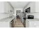 Stylish kitchen featuring stainless steel appliances, granite countertops, and tile backsplash at 213 Yuba Walk, Lawrenceville, GA 30046