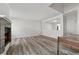 Spacious living room with wood floors, a brick fireplace, and a pass-through to the kitchen at 213 Yuba Walk, Lawrenceville, GA 30046