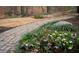 Beautiful backyard with stone path, lush grass, and a variety of trees and plants at 3572 Dexter Way, Marietta, GA 30062