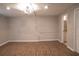 Unfinished basement showcasing wood-look floors, recessed lighting, and an adjacent bathroom at 3572 Dexter Way, Marietta, GA 30062