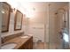Updated bathroom with double vanity, a frameless shower, and modern fixtures at 3572 Dexter Way, Marietta, GA 30062