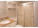 Bathroom features a shower with sliding glass doors, granite countertop, and floating shelves at 3572 Dexter Way, Marietta, GA 30062