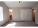Bedroom featuring neutral walls, carpet floors, and double closets with access to bathroom at 3572 Dexter Way, Marietta, GA 30062